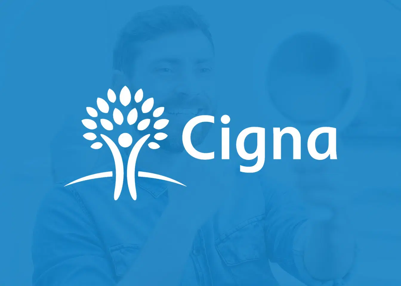 Cigna logo with white tree symbol on blue background representing dental insurance provider.
