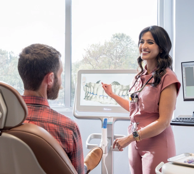 Dr. Shria Dhaon Treating a young male dental patients at her dental office in Austin